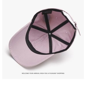 Detail view of the washed baseball cap interior showing stitching and adjustable strap