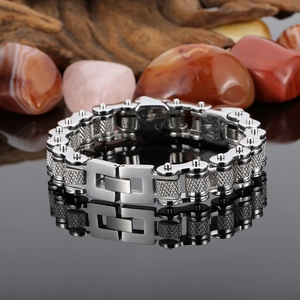 Detailed close-up of silver stainless steel motorcycle chain bracelet with anti-slip texture