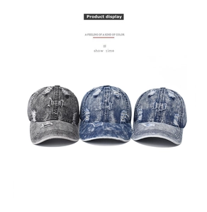 Detailed row of distressed washed denim baseball caps with vintage ripped style accents