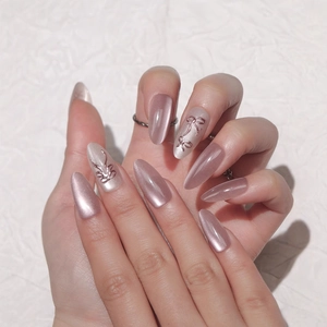 Pink cat eye press-on nails with long almond shape and 3D bow design for women