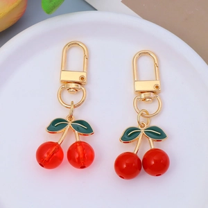 Cute red cherry pendant keychain with green leaves and gold lobster clasp for bags