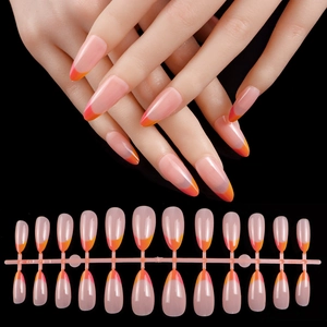 Detailed set of 24 long almond nude press-on nails with vibrant orange French tips