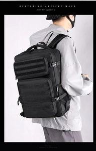 Detail of black tactical backpack with Molle webbing and durable nylon fabric material