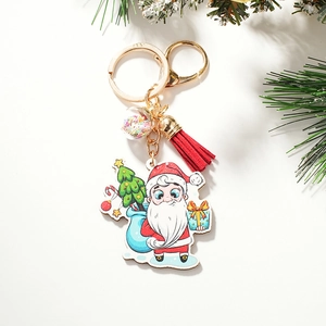 Detailed view of cartoon Santa keychain with red tassel and festive ornaments