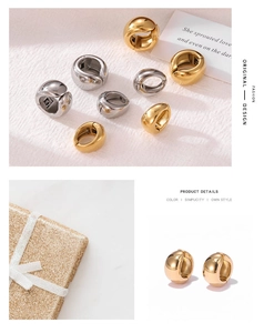 Polished gold and silver metal hoop earrings displayed with a luxury gift box