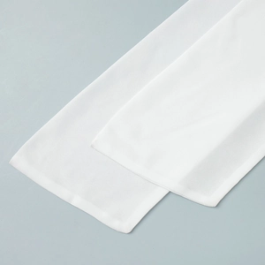 Close-up of semi-sheer white chiffon fabric showing detailed texture and hem stitching