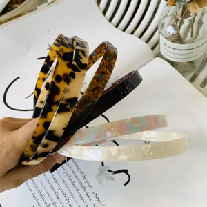 Minimalist leopard and tortoiseshell acetate headbands in assorted stylish patterns