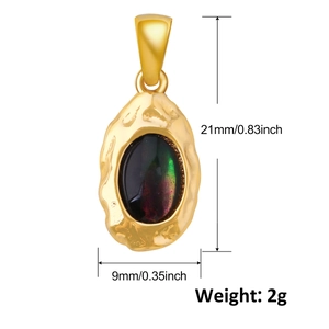 Detailed view of a 21mm gold teardrop pendant with black shell inlay and texture