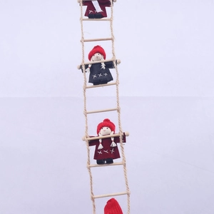 Detail of wool felt elves climbing a wooden rope ladder for Christmas fireplace decor