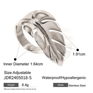 Macro view of silver monstera leaf ring showing waterproof and hypoallergenic features
