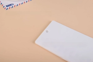 Detailed macro view of a white rectangular memo card insert for RV checklist board