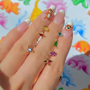 Adorable gold-plated dinosaur stud earrings with colorful cubic zirconia crystals
