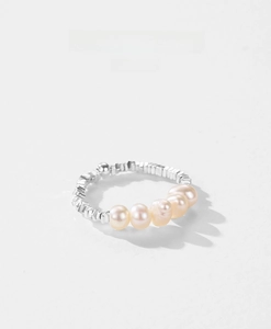 Detailed macro view of 925 sterling silver ring with five elegant natural freshwater pearls
