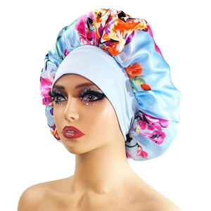 Floral satin sleep bonnet in light blue with wide elastic band for curly hair protection