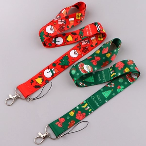 Detail of Christmas themed lanyards featuring Merry Christmas prints and metal lobster claw clasp