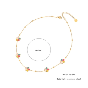 Detailed macro view of the gold-plated flower necklace with colorful macaron petals