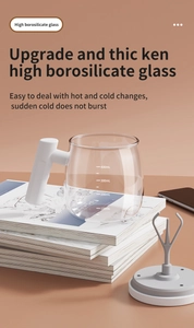 Detailed view of heat-resistant glass self-stirring cup with 400ml scale and white handle