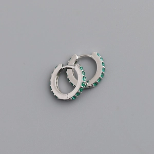 Detailed close-up of 925 sterling silver hoop earrings set with small green zircons