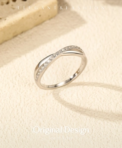 Close-up of S925 silver ring featuring polished bands and pavé cubic zirconia accents
