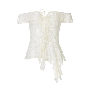 Detailed close-up of white lace off-shoulder top with ruffles and irregular hemline