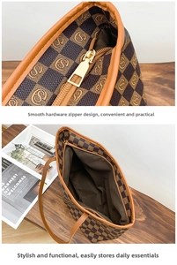Detail of checkered tote bag showing gold zipper and spacious interior storage