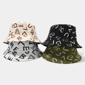 Graffiti print bucket hats for sun protection in beige black white and olive green