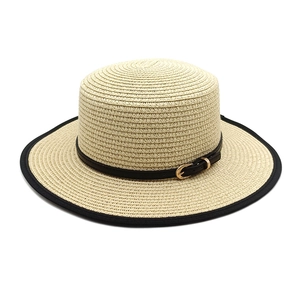 Flat top straw sun hat with black trim and leather buckle belt for summer beach wear