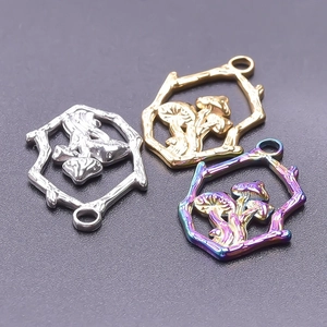 Macro shot of hexagon mushroom pendants in silver, gold and rainbow stainless steel finishes