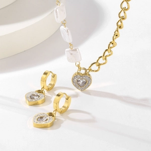 Golden heart jewelry set with white crystals and square pearls necklace and earrings