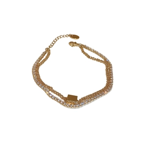 Double-layered gold plated bracelet featuring square zircon and a rectangular tag charm