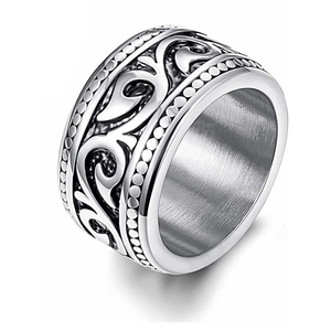 Vintage stainless steel wide ring with relief scroll pattern and brushed inner finish
