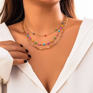 Three-layer gold chain necklace with colorful heart charms and paperclip link chain