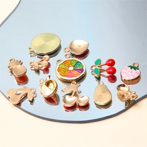Colorful fruit charms for jewelry making featuring strawberry cherry and pineapple shapes