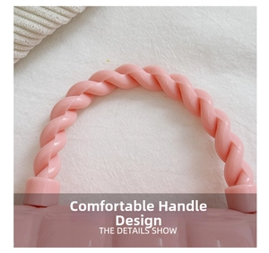 Detailed macro shot of the pink jelly bag featuring a comfortable twisted handle design