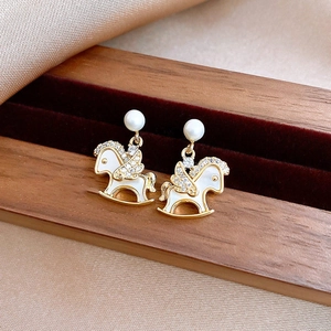 Exquisite gold-plated rocking horse stud earrings with white enamel and shimmering crystals