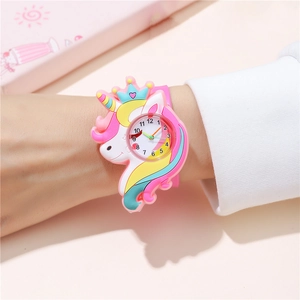 Detailed view of kids cartoon unicorn watch with clear dial numbers on a pink strap