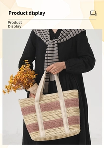 Detail of handmade striped straw tote bag with textured woven pattern and canvas handles