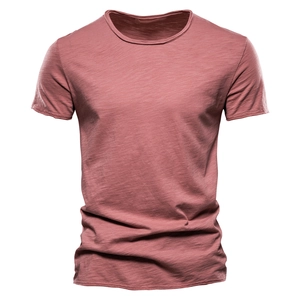 Detail of dusty rose slub cotton T-shirt showing retro rolled hem and V-neck texture