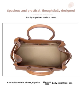 Top view of the spacious leather bag interior with a zipper pocket and daily essentials