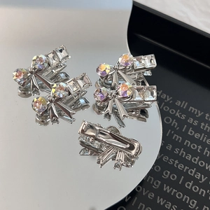 Bow-shaped silver alloy hair clips with sparkling rhinestones in a set of five pieces