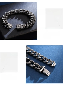 Macro detail of retro stainless steel chain bracelet with carved totem and skull textures