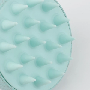 Mint green silicone scalp massager brush with 19 conical bristles for hair care