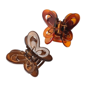 Elegant large butterfly hair claw clips in translucent brown and amber colors