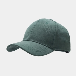 Detailed view of dark green fleece baseball cap fabric texture and stitched eyelets