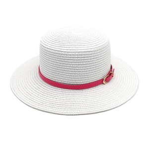 White flat top straw boater hat with a bright rose red band and golden metal buckle