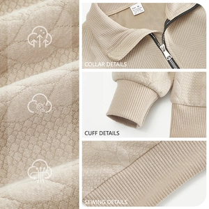 Detail view of beige knit texture with zipper and cuff stitching for outdoor sweatshirt
