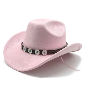Detailed view of pink suede fedora hat featuring a black leather band and turquoise studs
