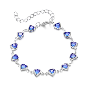 Silver bracelet with deep blue heart-shaped gems and adjustable lobster clasp