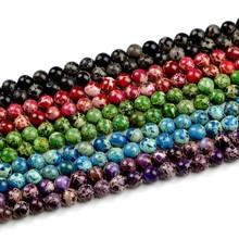 Detailed view of assorted natural stone beads in various colors for DIY jewelry making