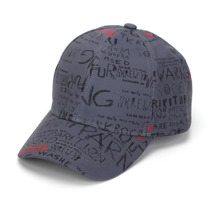 Detail of dark grey baseball cap with graffiti print lettering and twill cotton texture